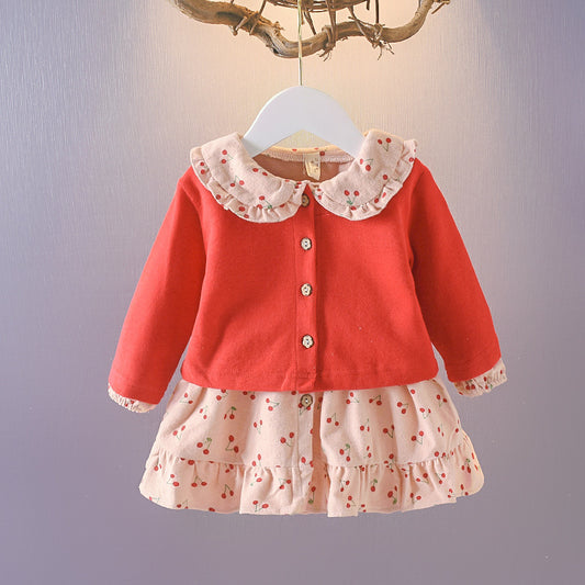 Wrap your baby girl in vintage charm with this adorable two-piece cotton set. Featuring a ruffled cardigan and cherry-print skirt, this breathable, stylish ensemble is perfect for any season!