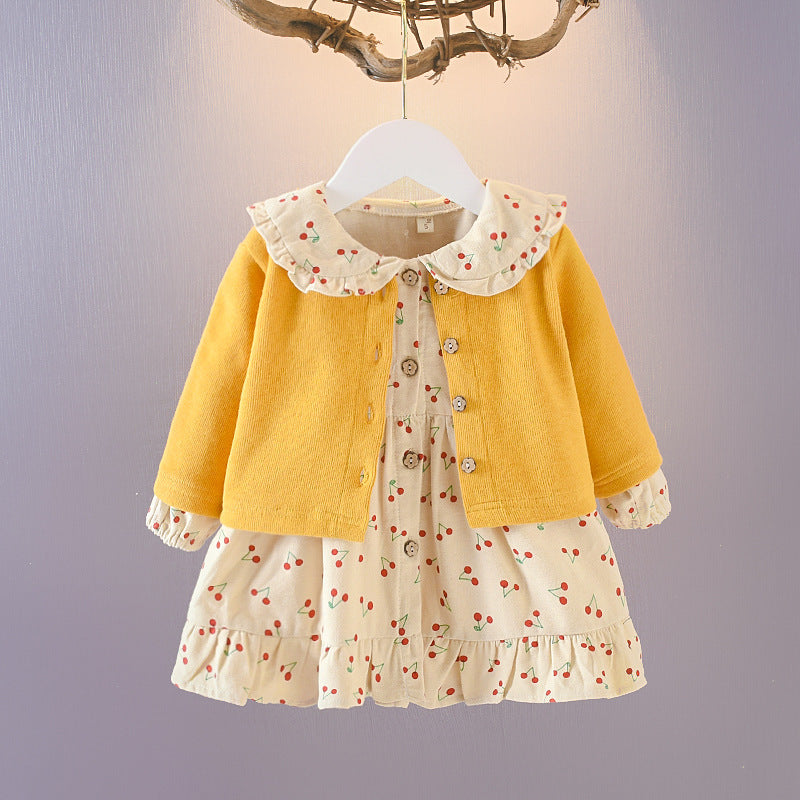 Wrap your baby girl in vintage charm with this adorable two-piece cotton set. Featuring a ruffled cardigan and cherry-print skirt, this breathable, stylish ensemble is perfect for any season!