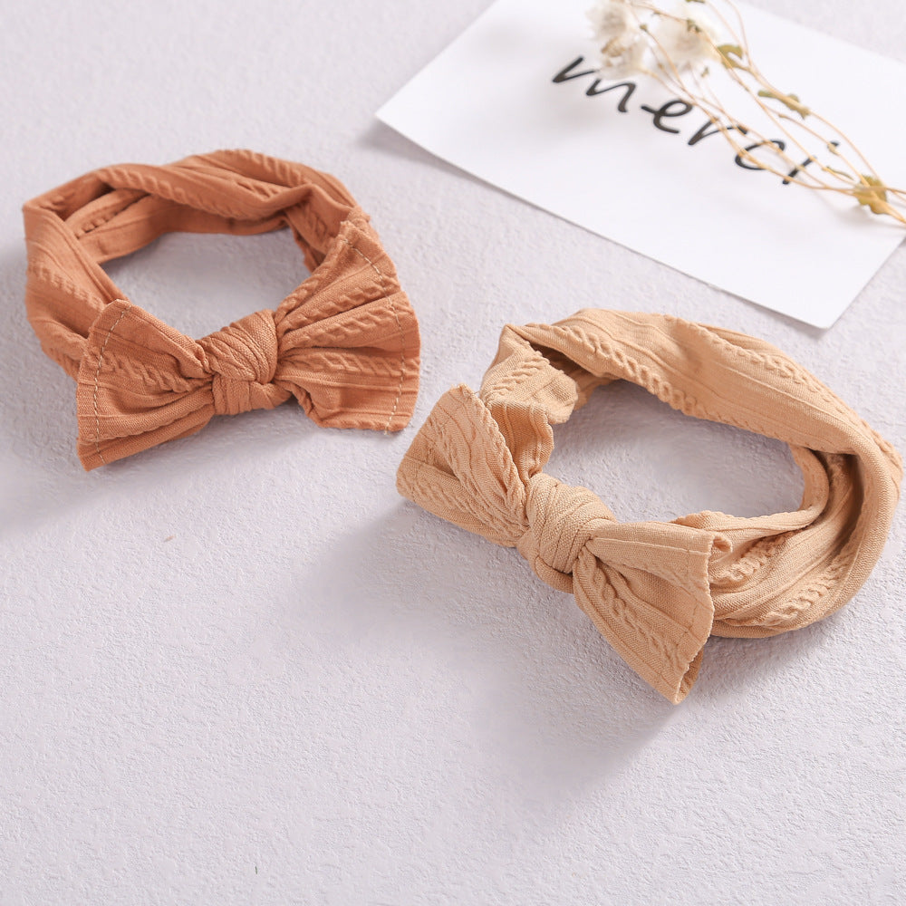 Add a stylish touch to your baby’s look with our soft, stretchy nylon bow headband. Gentle, comfortable, and perfect for everyday wear or special occasions