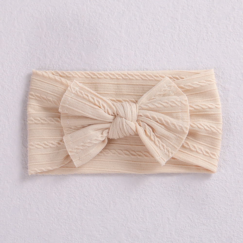 Add a stylish touch to your baby’s look with our soft, stretchy nylon bow headband. Gentle, comfortable, and perfect for everyday wear or special occasions
