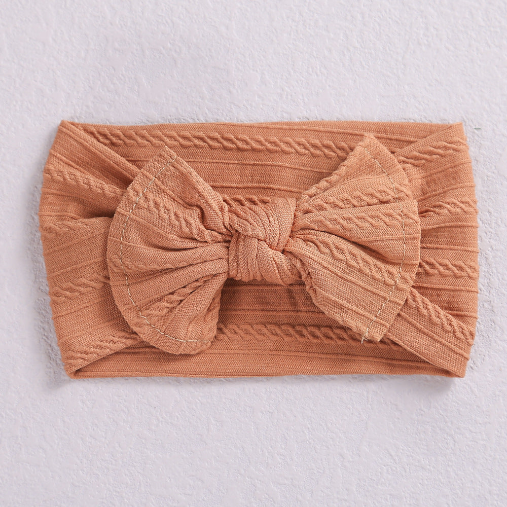 Add a stylish touch to your baby’s look with our soft, stretchy nylon bow headband. Gentle, comfortable, and perfect for everyday wear or special occasions
