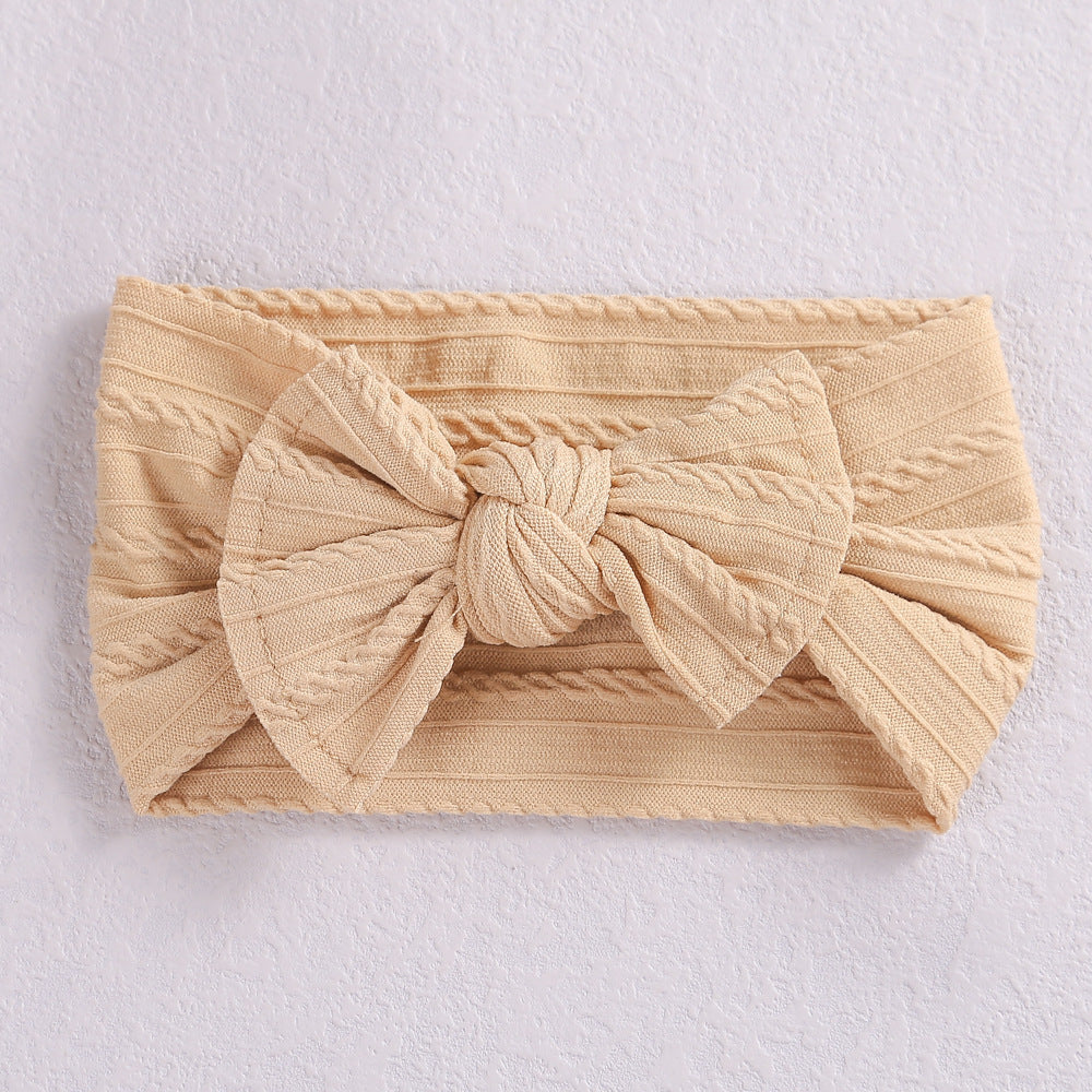 Add a stylish touch to your baby’s look with our soft, stretchy nylon bow headband. Gentle, comfortable, and perfect for everyday wear or special occasions