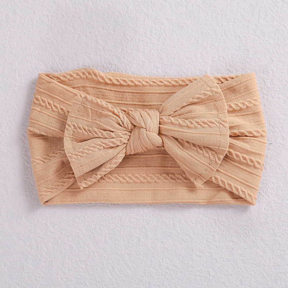 Add a stylish touch to your baby’s look with our soft, stretchy nylon bow headband. Gentle, comfortable, and perfect for everyday wear or special occasions