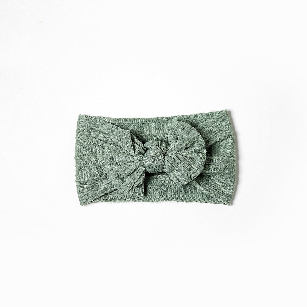 Add a stylish touch to your baby’s look with our soft, stretchy nylon bow headband. Gentle, comfortable, and perfect for everyday wear or special occasions