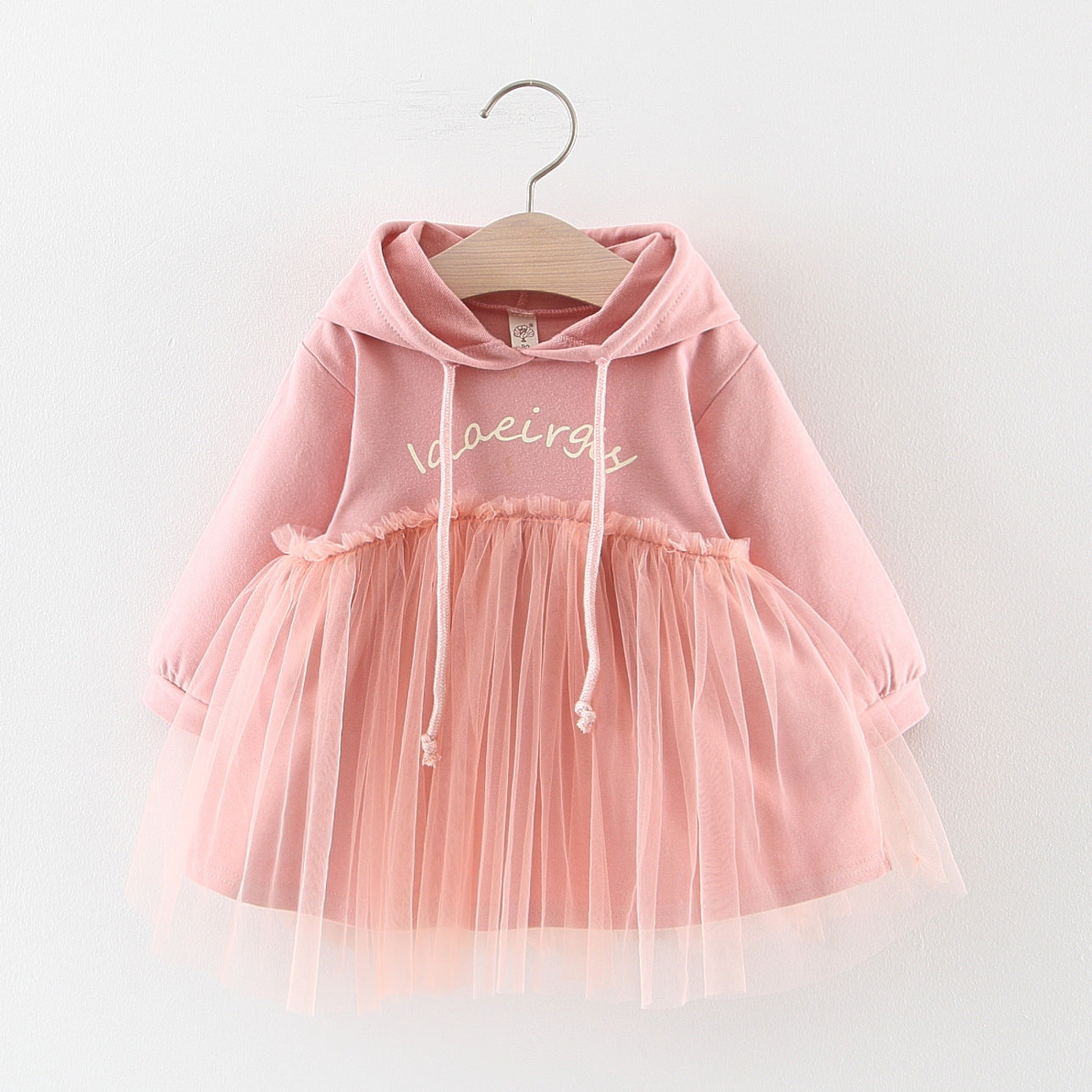 Discover the perfect mix of cozy and chic! This adorable hoodie dress features a soft cotton top with a layered tulle skirt. Perfect for playdates & outings!