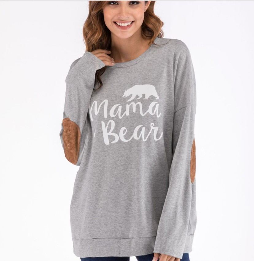 Stay comfy & stylish with this Mama Bear maternity top! A must-have for expecting & new mums, featuring soft fabric, elbow patches & a relaxed fit.