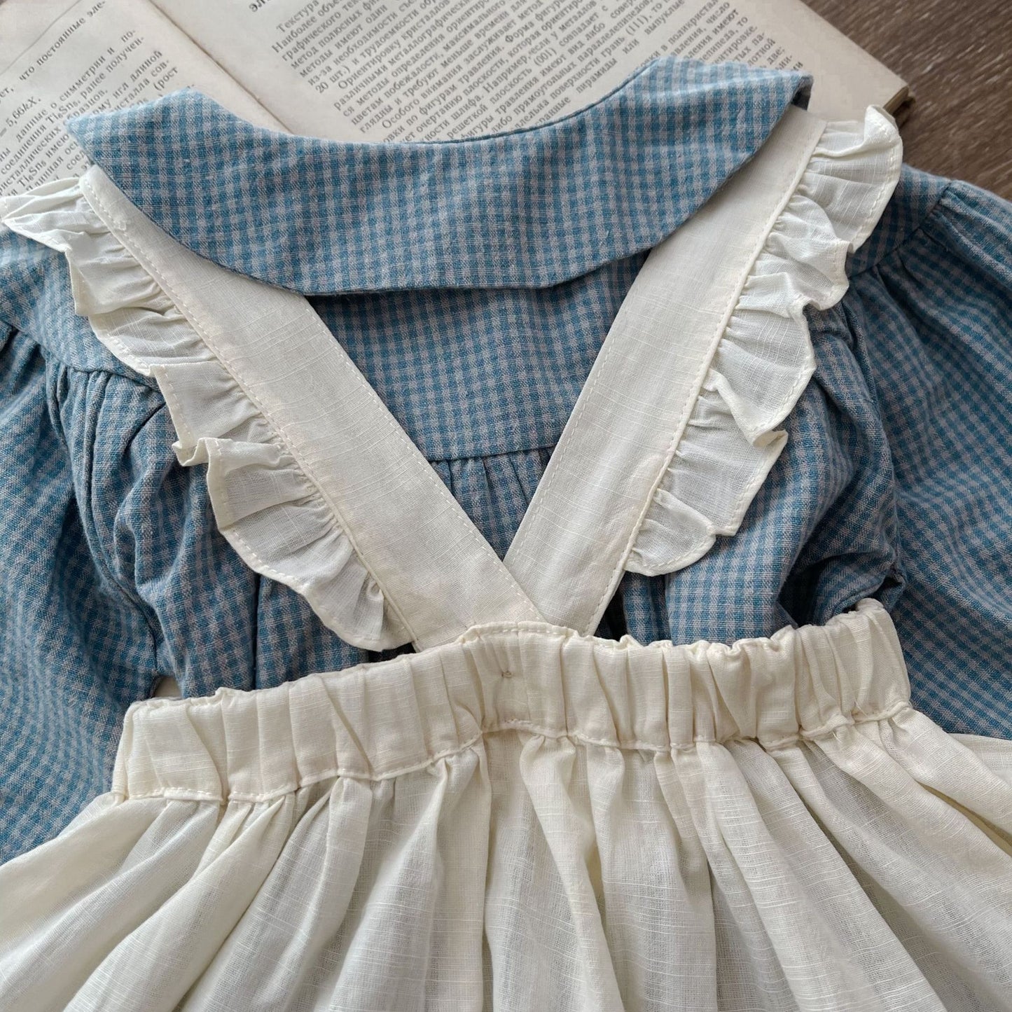 Dress your little one in timeless charm with this Vintage Plaid Romper & Ruffle Pinafore Set. Soft cotton, delicate ruffles & a classic doll collar design