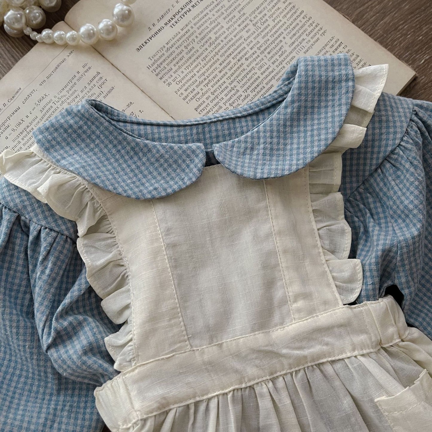 Dress your little one in timeless charm with this Vintage Plaid Romper & Ruffle Pinafore Set. Soft cotton, delicate ruffles & a classic doll collar design