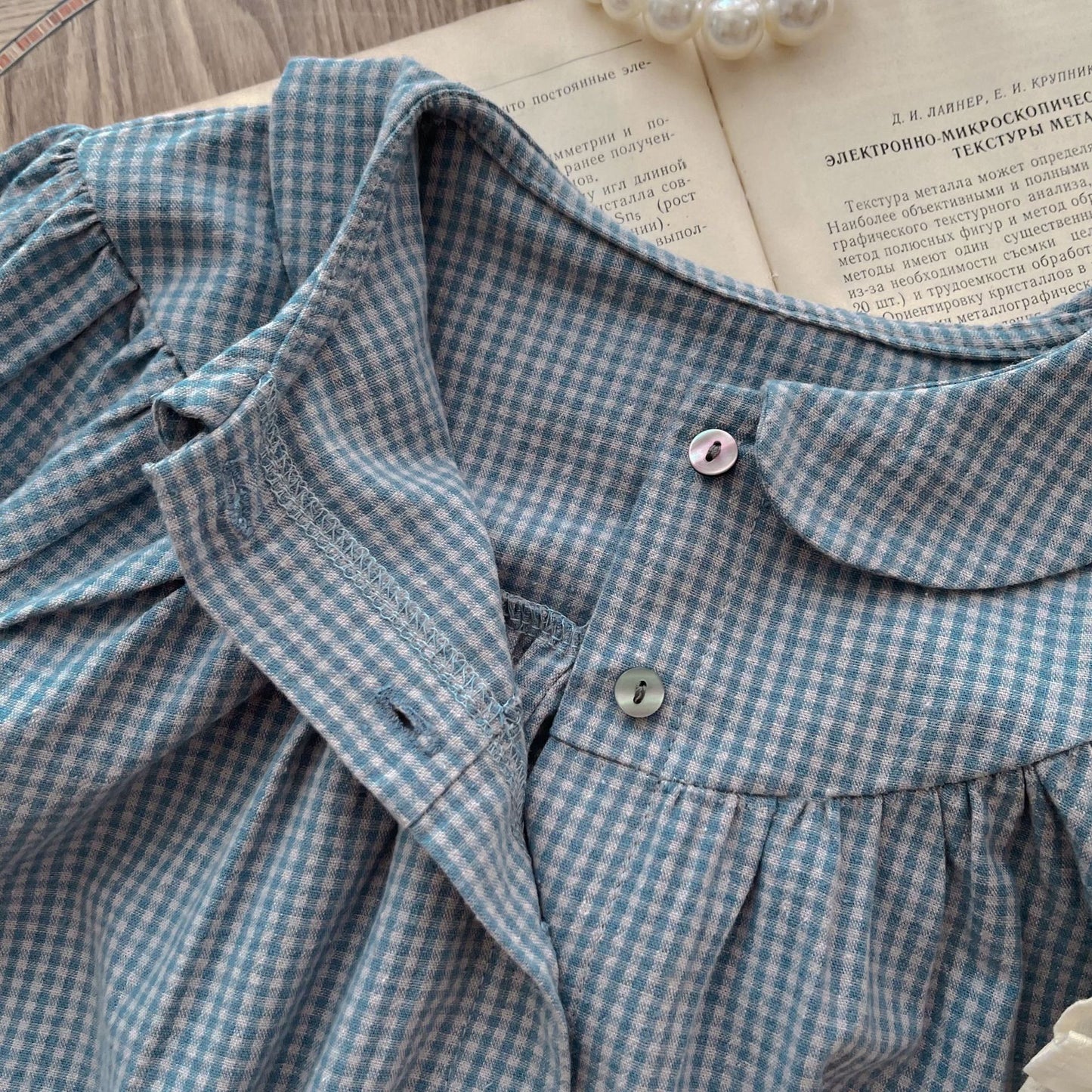 Dress your little one in timeless charm with this Vintage Plaid Romper & Ruffle Pinafore Set. Soft cotton, delicate ruffles & a classic doll collar design