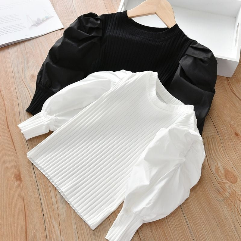 A chic and stylish puff sleeve top for girls! Made from soft, breathable cotton, this trendy top is perfect for everyday wear, playdates, or special occasions. Available in white & black.