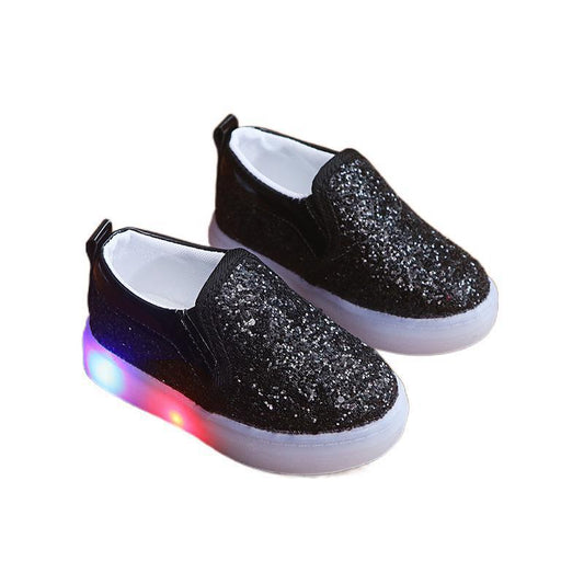 Add some sparkle to your little oneβs steps with Luxe Sparkle LED Sneakers! Featuring shimmering sequins, motion-activated LED lights, and an easy slip-on fit. Perfect for stylish kids!