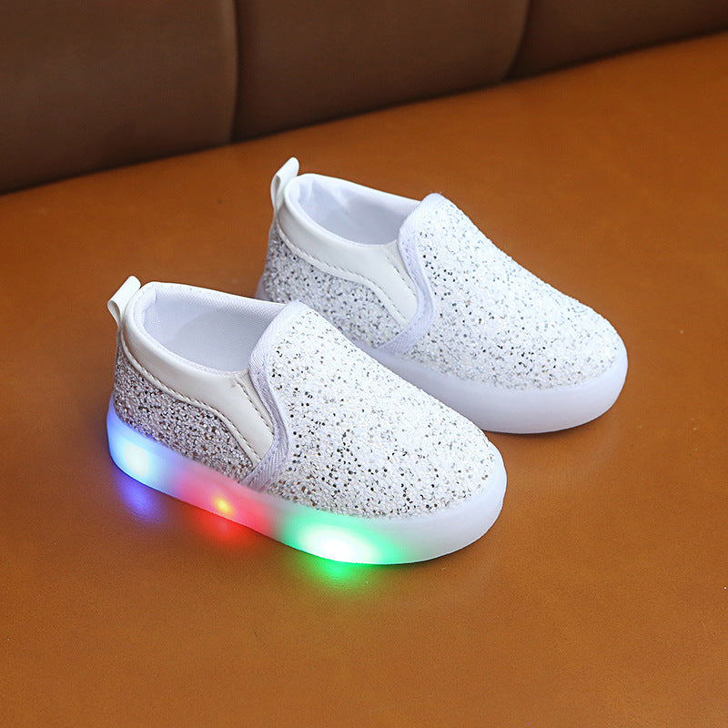 Add some sparkle to your little one’s steps with Luxe Sparkle LED Sneakers! Featuring shimmering sequins, motion-activated LED lights, and an easy slip-on fit. Perfect for stylish kids!
