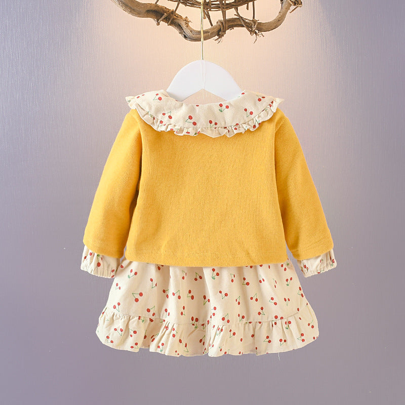 Wrap your baby girl in vintage charm with this adorable two-piece cotton set. Featuring a ruffled cardigan and cherry-print skirt, this breathable, stylish ensemble is perfect for any season!