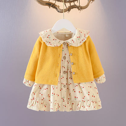 Wrap your baby girl in vintage charm with this adorable two-piece cotton set. Featuring a ruffled cardigan and cherry-print skirt, this breathable, stylish ensemble is perfect for any season!