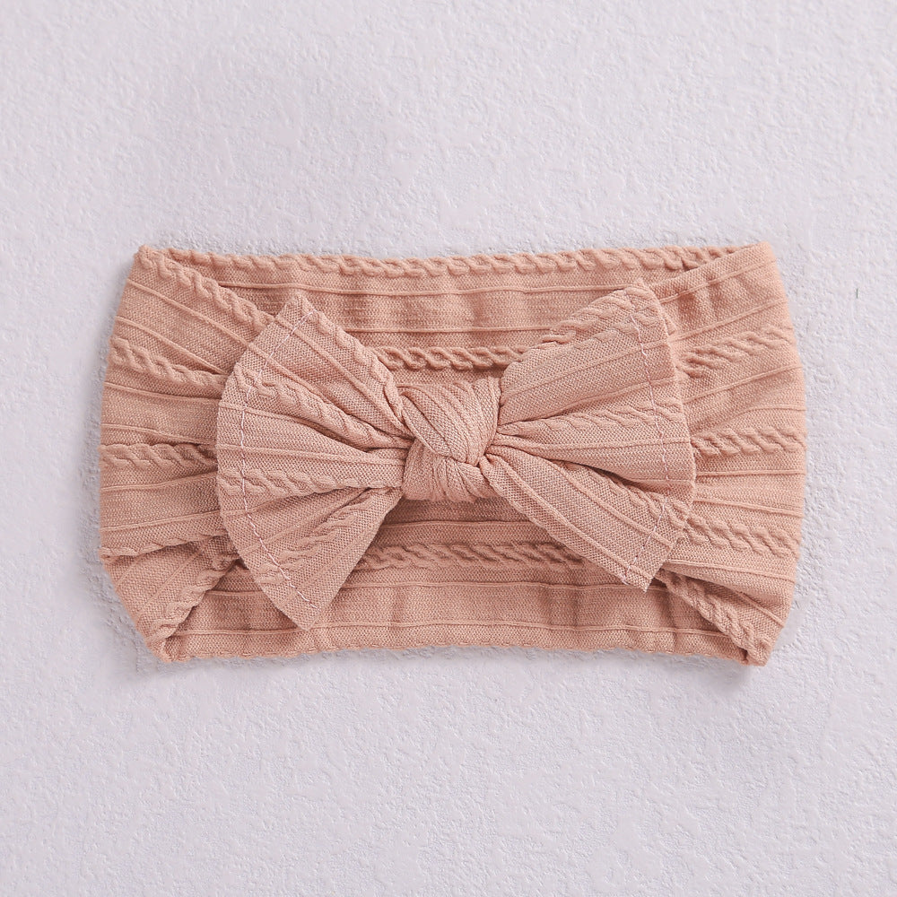 Add a stylish touch to your baby’s look with our soft, stretchy nylon bow headband. Gentle, comfortable, and perfect for everyday wear or special occasions