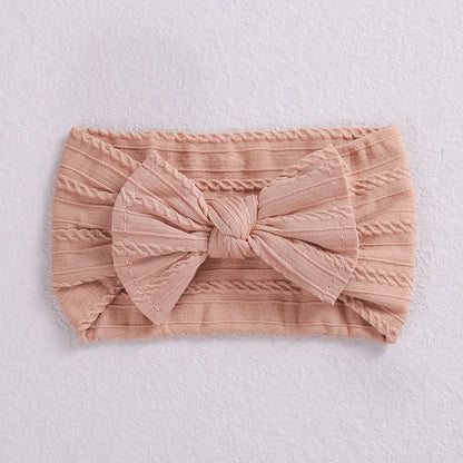 Add a stylish touch to your baby’s look with our soft, stretchy nylon bow headband. Gentle, comfortable, and perfect for everyday wear or special occasions