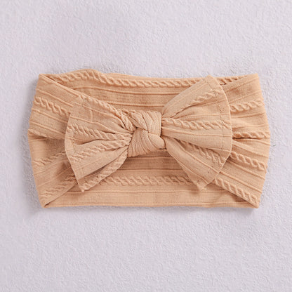 Add a stylish touch to your baby’s look with our soft, stretchy nylon bow headband. Gentle, comfortable, and perfect for everyday wear or special occasions