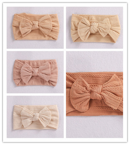 Add a stylish touch to your baby’s look with our soft, stretchy nylon bow headband. Gentle, comfortable, and perfect for everyday wear or special occasions