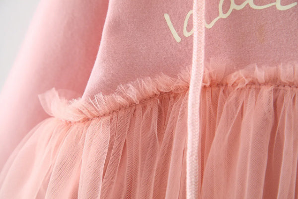 Discover the perfect mix of cozy and chic! This adorable hoodie dress features a soft cotton top with a layered tulle skirt. Perfect for playdates & outings!