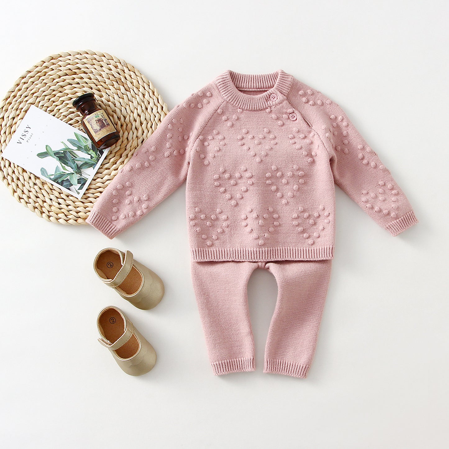 Keep your little one warm and stylish with our ultra-soft knitted sweater and pants set. Featuring delicate heart details and a cozy fit, it’s the perfect blend of comfort and charm!