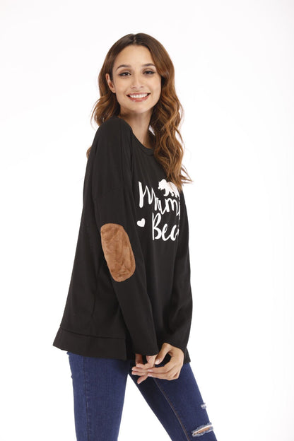 Stay comfy & stylish with this Mama Bear maternity top! A must-have for expecting & new mums, featuring soft fabric, elbow patches & a relaxed fit.