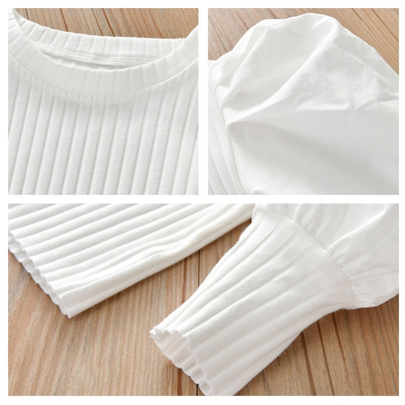 A chic and stylish puff sleeve top for girls! Made from soft, breathable cotton, this trendy top is perfect for everyday wear, playdates, or special occasions. Available in white & black.