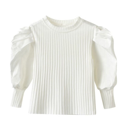 A chic and stylish puff sleeve top for girls! Made from soft, breathable cotton, this trendy top is perfect for everyday wear, playdates, or special occasions. Available in white & black.