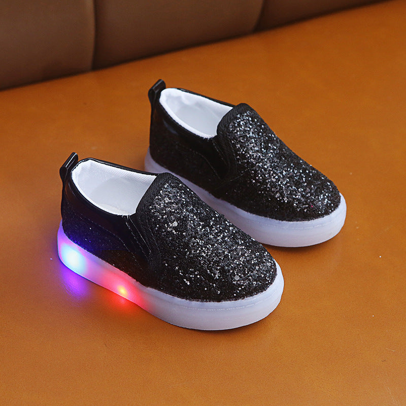 Add some sparkle to your little one’s steps with Luxe Sparkle LED Sneakers! Featuring shimmering sequins, motion-activated LED lights, and an easy slip-on fit. Perfect for stylish kids!